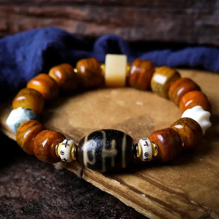 Bracelet ethnique en perles de baril craquelées en os de yak tibétain avec perle Dzi