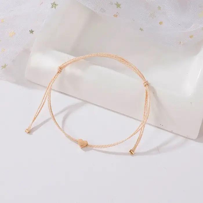 Bracelet en corde dorée avec pendentif cœur réglable pour femmes style bohème bijoux à la mode pour toutes les occasions