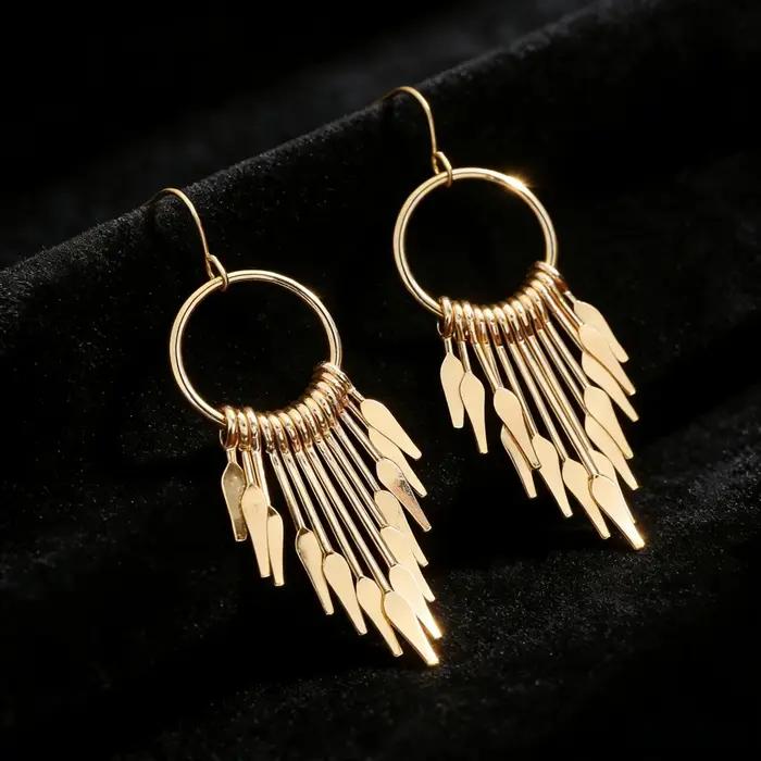 Boucles d'oreilles pendantes en or à pampilles