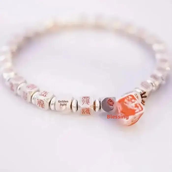 Bracelet cinabre porte-bonheur doré pour femme