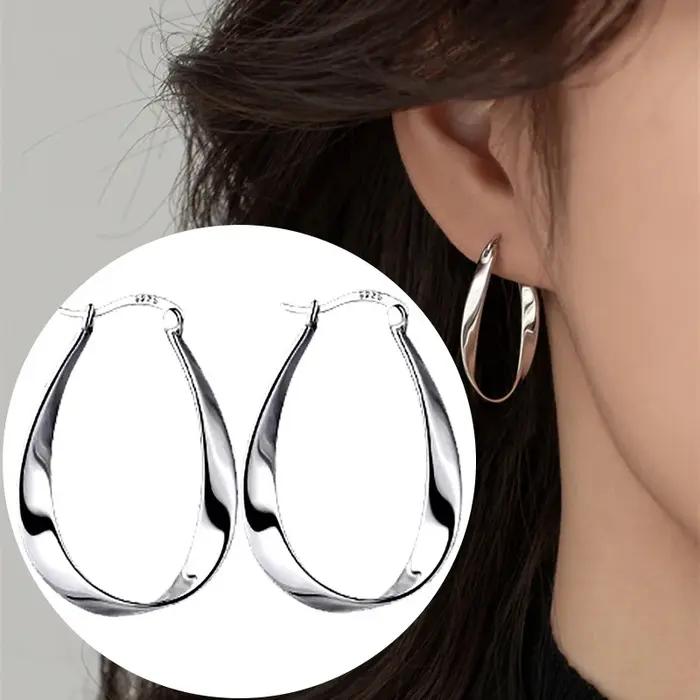 Boucles d'oreilles suspendues torsadées géométriques en argent 925 serties de zirconium pour femmes occasions spéciales cadeaux anniversaire moderne élégant
