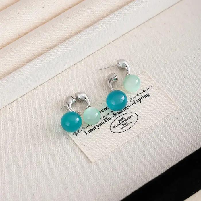 Boucles d'oreilles élégantes d'été