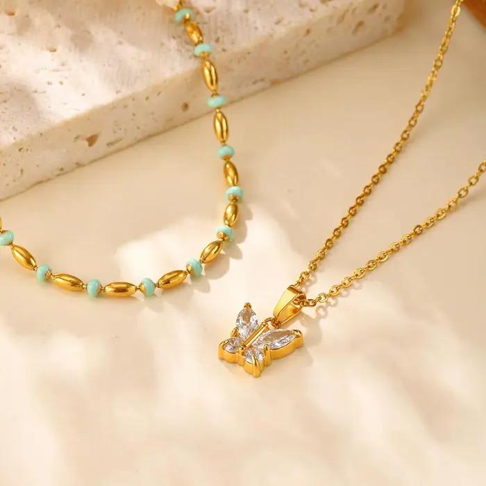 Collier en forme de papillon serti de zircone cubique plaqué or pour femmes occasions spéciales partys et mariages