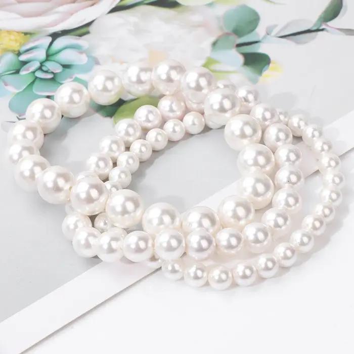 Bracelet élastique en perles de coquillage naturel blanc pour femme