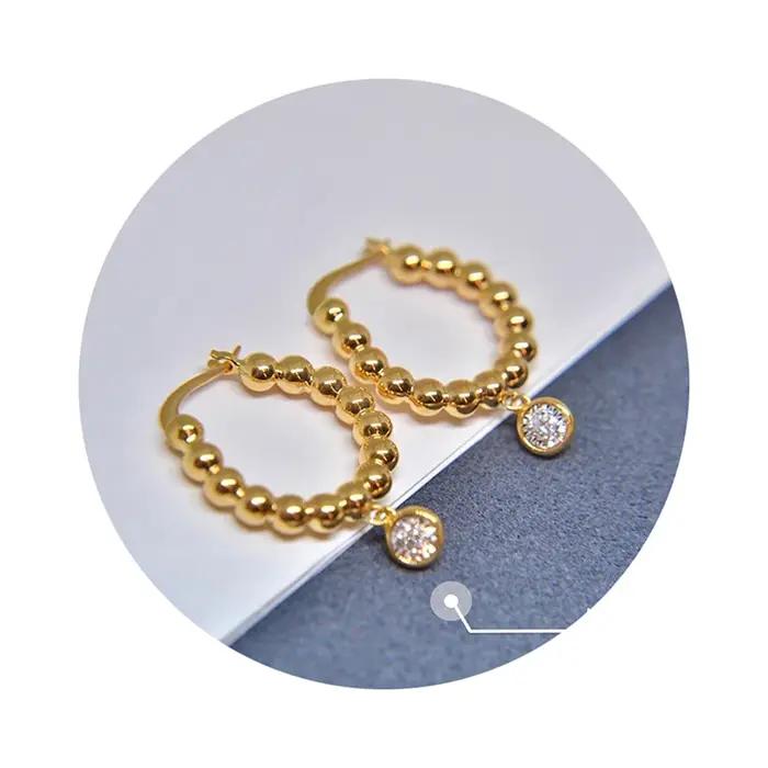 Huitan – boucles d'oreilles créoles délicates avec design perlé