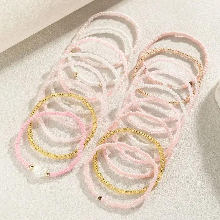 Lot de 17 bracelets en perles pastel pour femme