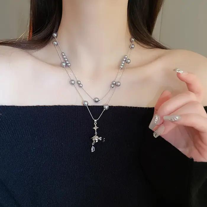 Collier de perles en forme de goutte d'eau saturne incrustée de diamants