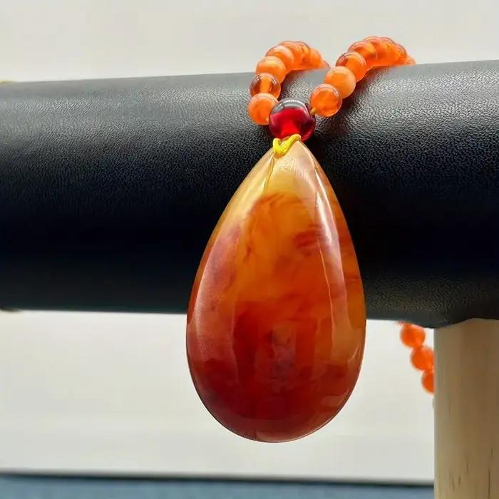 Collier pendentif goutte d'ambre, amulette porte-bonheur, élégant