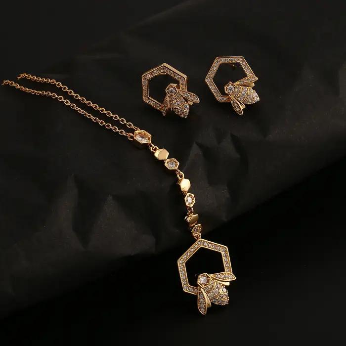 Ensemble collier et boucles d'oreilles en forme de Y plaqué or avec motif nid d'abeille pour femme