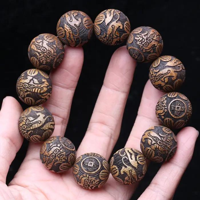 Bracelet en bois naturel sculpté dieu bête richesse