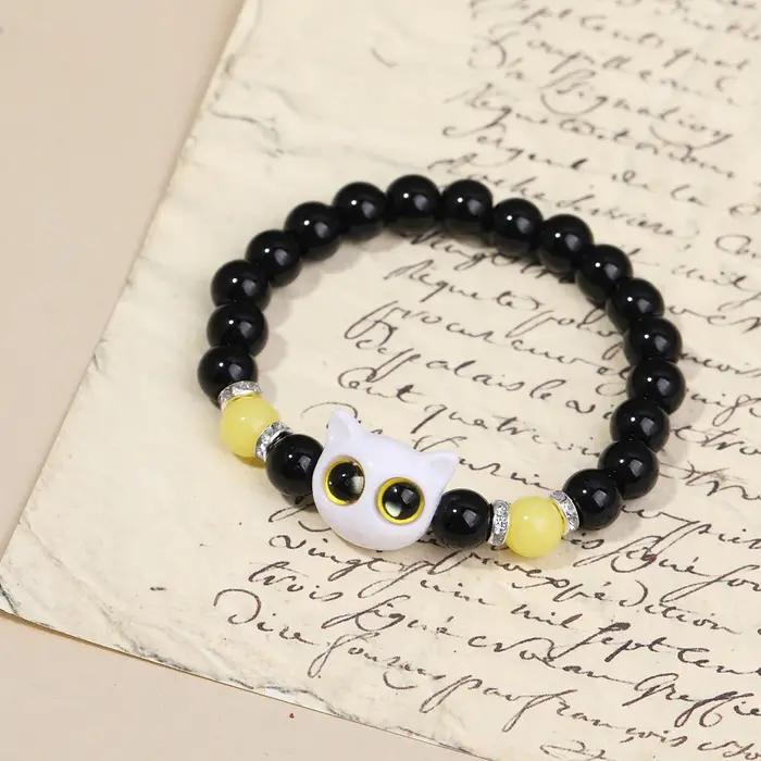 Couple de chat de dessin animé brillant avec paire de bracelets