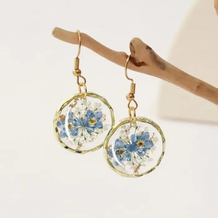 Boucles d'oreilles rondes irrégulières élégantes à motif floral