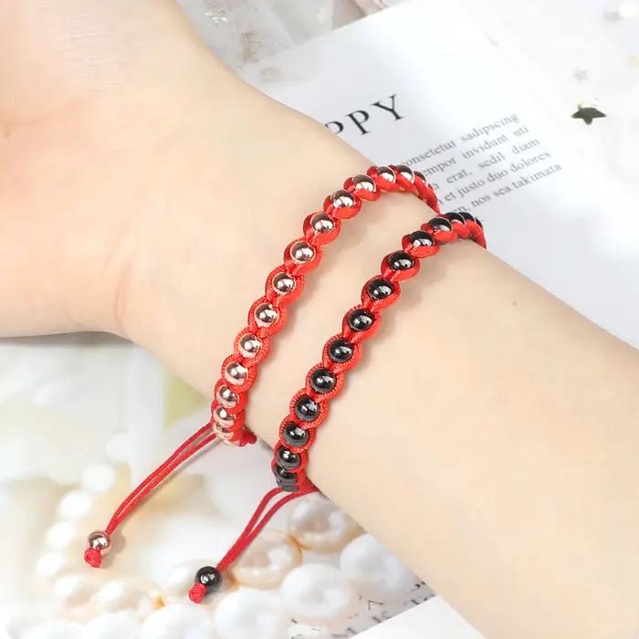 Bracelet Tressé Porte-Bonheur RaeRina en Corde Rouge et Perles en Cuivre Pour Homme et Femme Occasions Spéciales