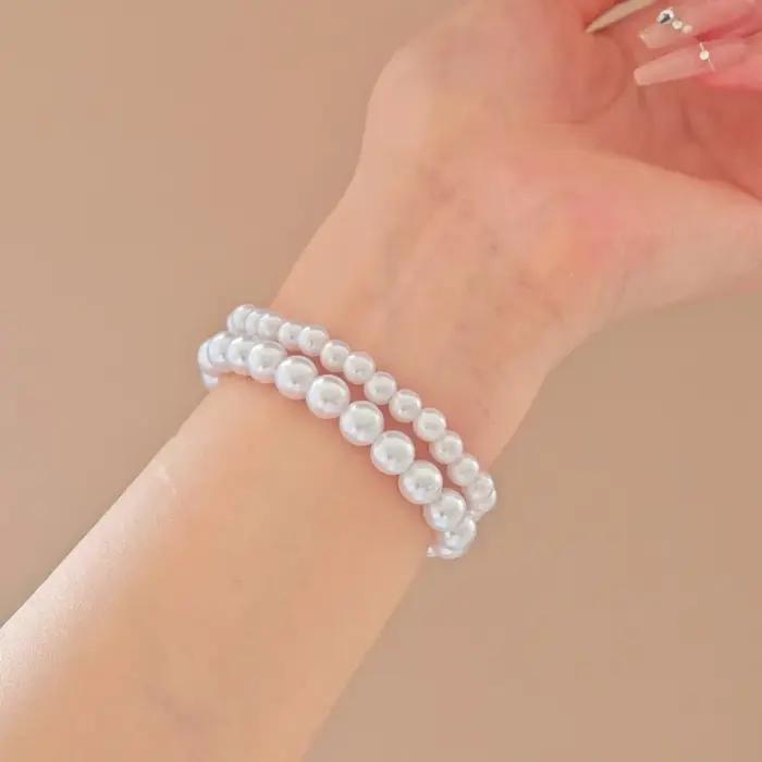 Bracelets en perles d'imitation classiques avec finition plaquée platine pour femmes, bracelets à brins rétro élégants pour occasions spéciales