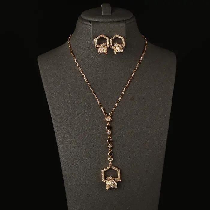 Ensemble collier et boucles d'oreilles en forme de Y plaqué or avec motif nid d'abeille pour femme