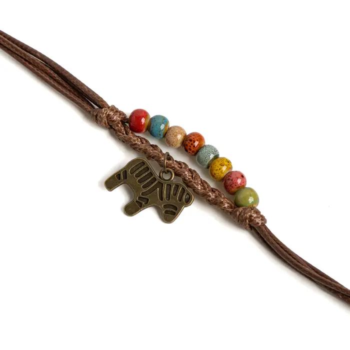 Bracelet perlé en céramique coloré avec breloque cheval