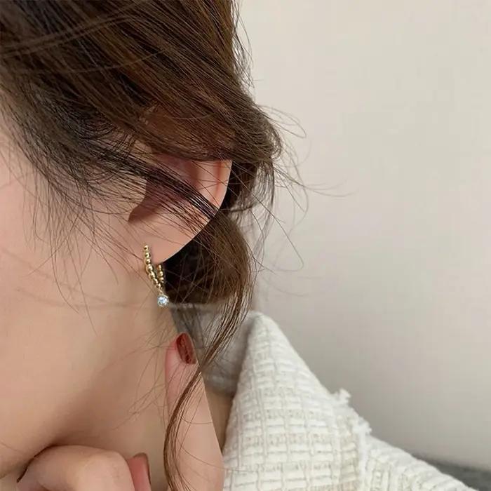 Huitan – boucles d'oreilles créoles délicates avec design perlé