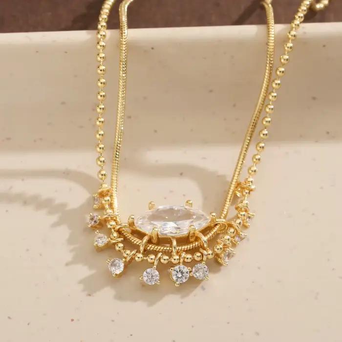 Collier de luxe en cuivre pour femmes avec pierres précieuses artificielles de forme marquise et design à pompon, idéal pour les mariages et les banquets.