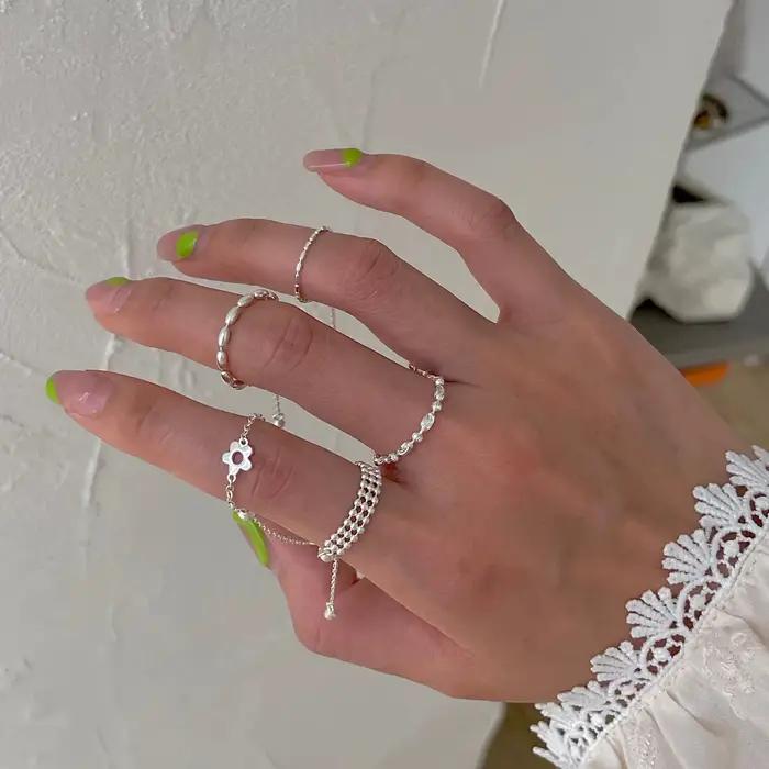 PONYKISS – bague en forme de fleur couleur argent avec longue chaîne à pampilles