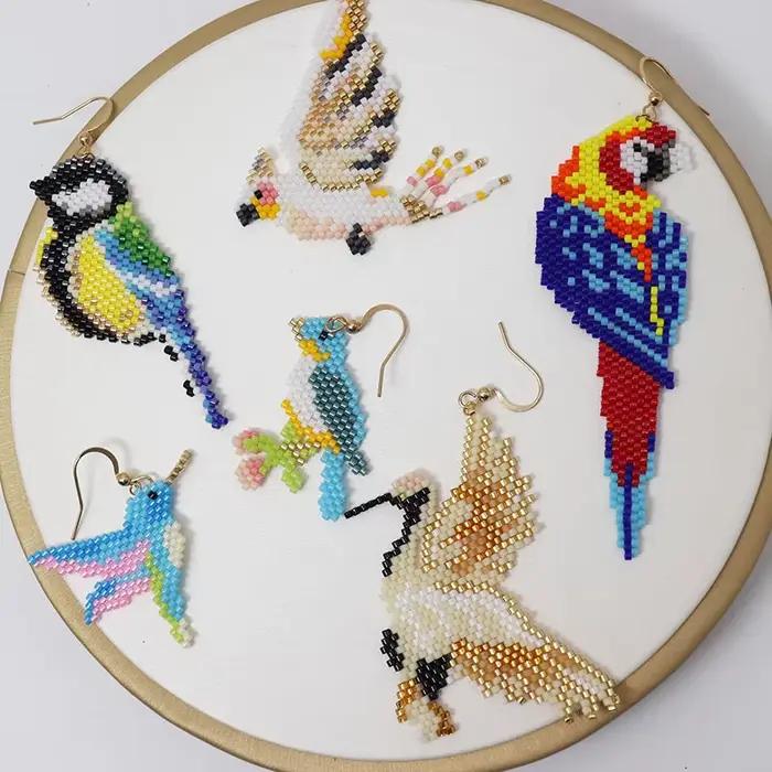 Boucles d'oreilles perlées pour oiseaux de perroquet, boucles d'oreilles en perles de riz, alliage simple, conception originale de Bohême, tricot à la main, marée