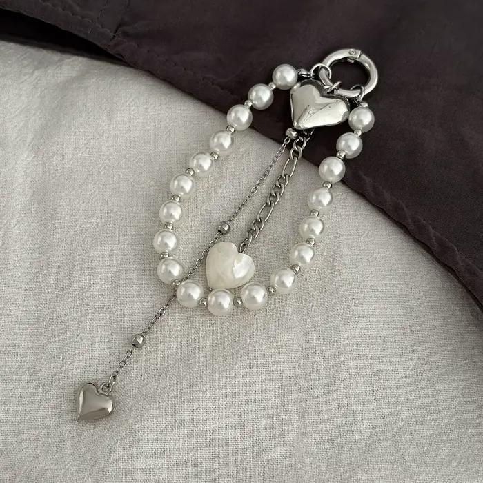 Nouveau porte-clés chaîne de perles 2025 nouveau coeur de pêche perle sac chaîne pendentif bijoux accessoires perle porte-clés cadeaux décor