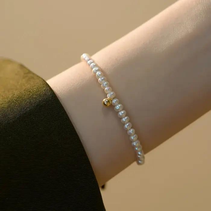 Nouveau Bracelet coeur perle pour femmes tempérament classique perlé métal pêche amour artisanat à l