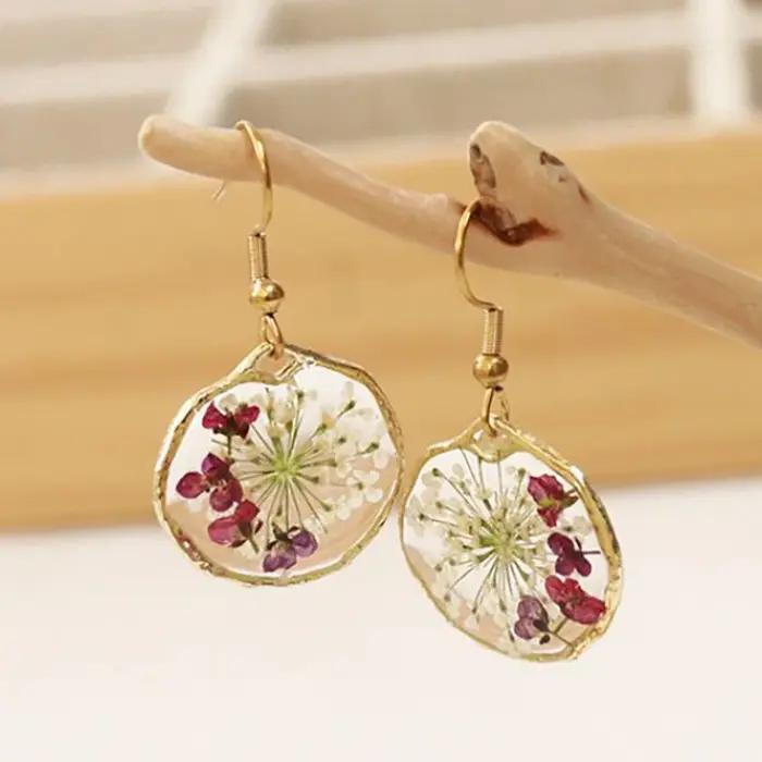Boucles d'oreilles rondes irrégulières élégantes à motif floral