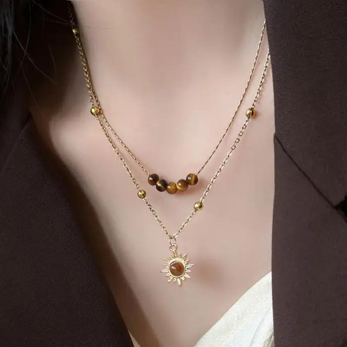 Colliers avec pendentif soleil couleur or