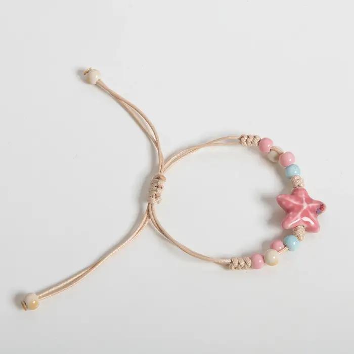 Bracelet en céramique étoile rose fait à la main pour femmes