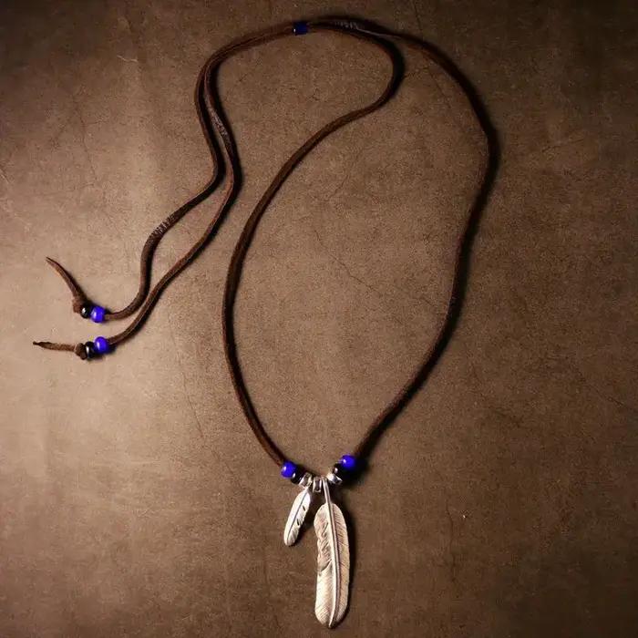 Collier en corde de cuir avec pendentif Turquoise en plumes rétro indiennes