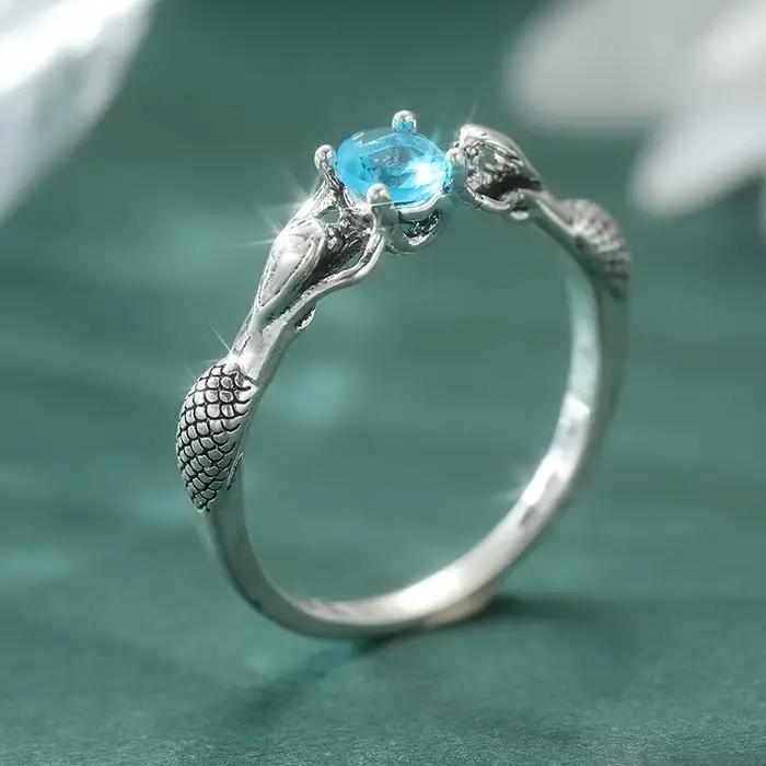 Bague vintage délicate sculptée en zircone synthétique bleue argentée, design élégant et chic pour f