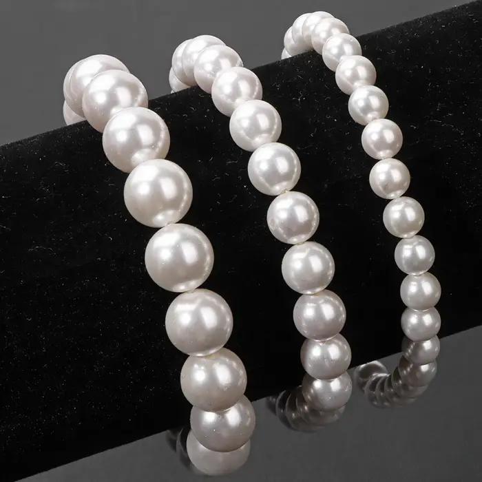 Bracelet élastique en perles de coquillage naturel blanc pour femme