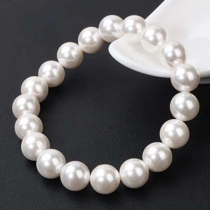 Bracelet élastique en perles de coquillage naturel blanc pour femme