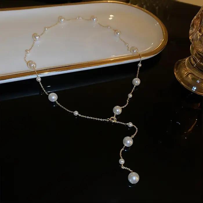 Nouveau Simple Long Imitation perles dos collier pour femmes Sexy gland perle harnais Bikini poitrine chaîne corps bijoux Mujer