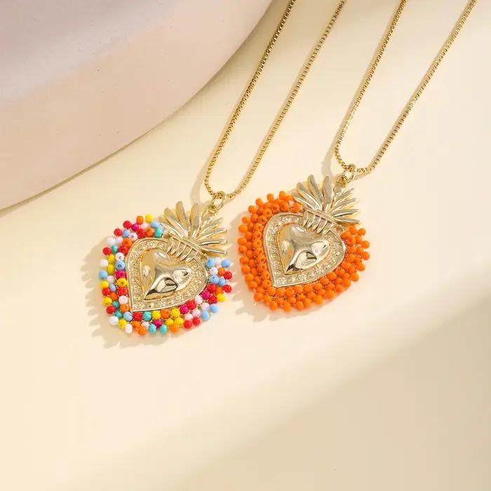 Nidin – collier avec pendentif en forme de cœur sacré