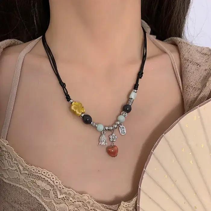 Collier pendentif papillon perlé rétro de style Melard pour femme, perles colorées, pull à deux couc